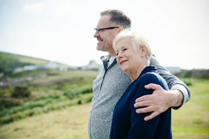 two senior citizens on hillside